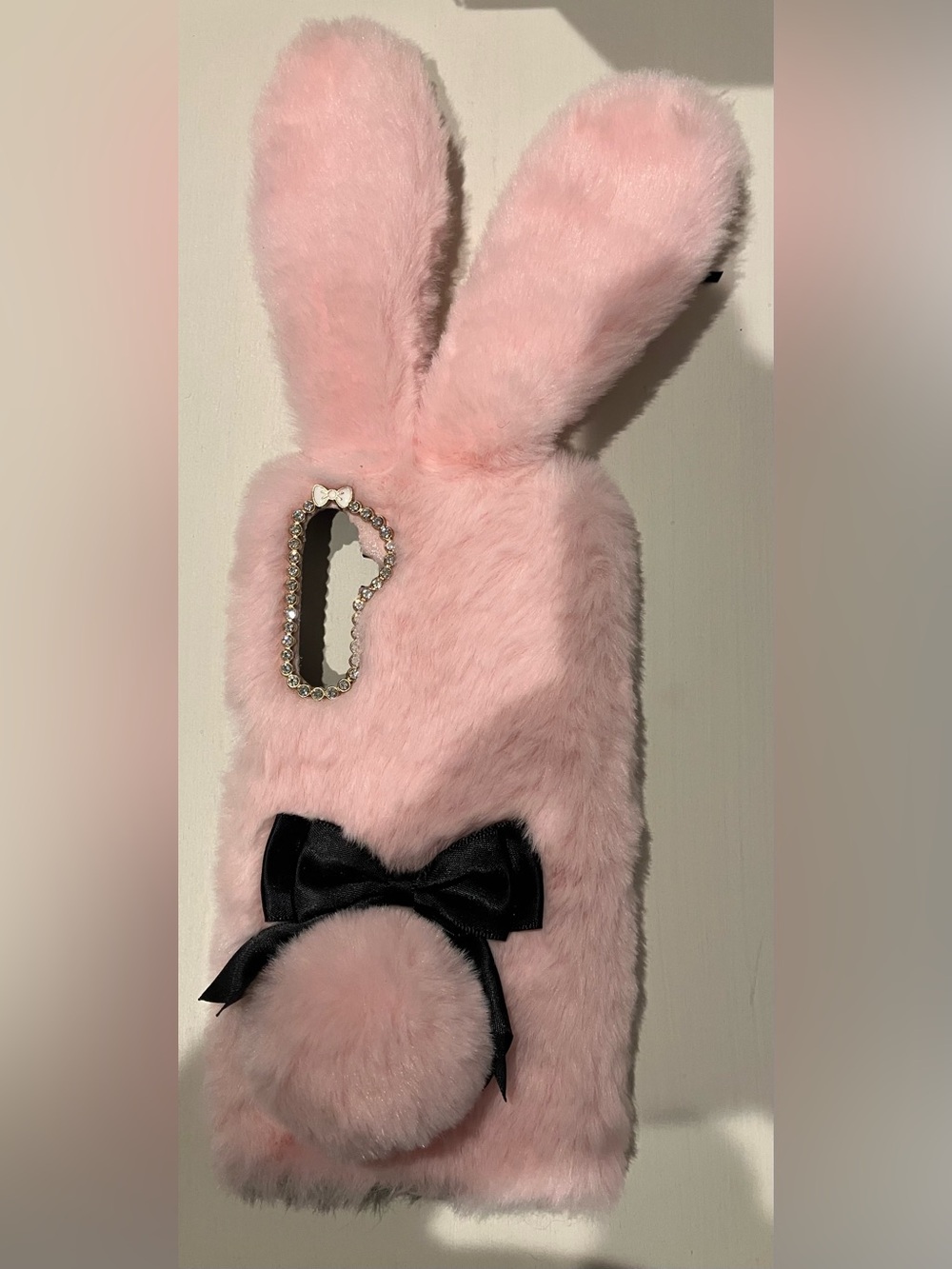 Pink plush bunny-ears phone case fluffy tail black bows rhinestone camera cutout